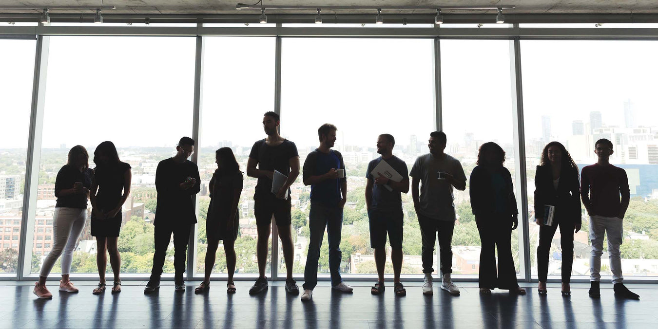 Large Group Standing in Office
